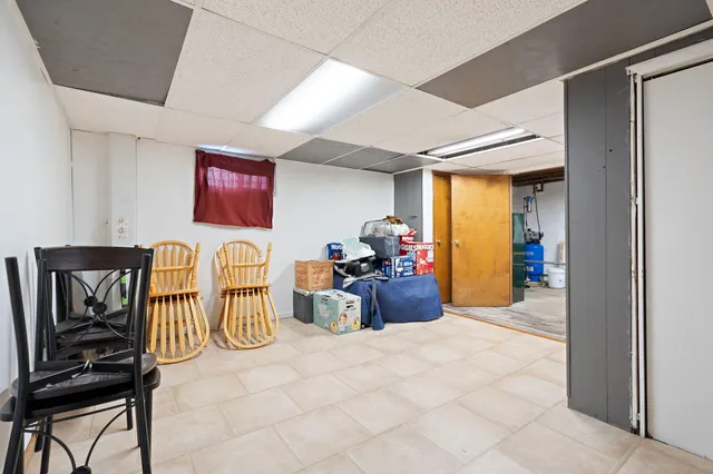 a view of a livingroom with furniture and workspace