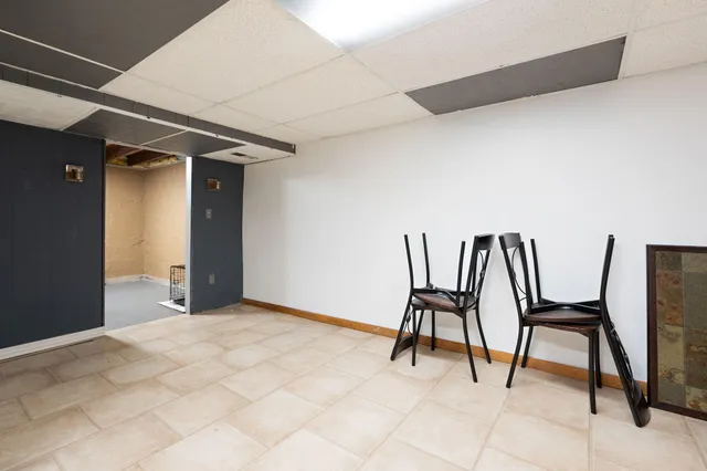 a view of an chairs and table in a room