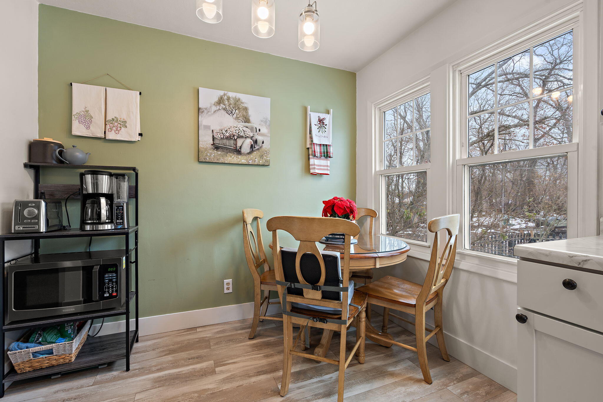 601 Azalea Street Southeast Demotte, IN 46310 - Photo 9 of 29 a view of a dining room with furniture window and wooden floor
