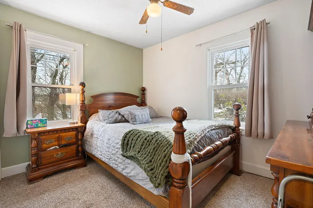 a bed room with a bed and a window