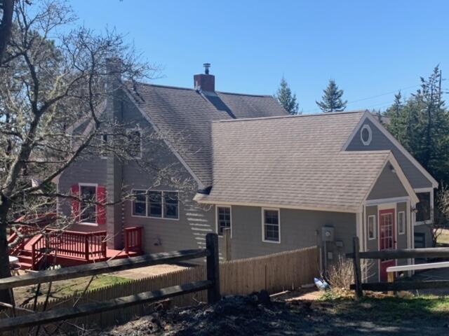 87 Massasoit Road Wellfleet, MA 02667 - Photo 3 of 26 a front view of a house with a yard