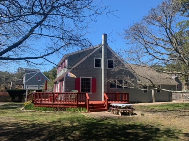87 Massasoit Road Wellfleet, MA 02667 - Photo 4 of 26 a view of a house with backyard