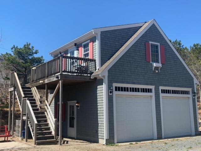 87 Massasoit Road Wellfleet, MA 02667 - Photo 5 of 26 a view of a house with balcony