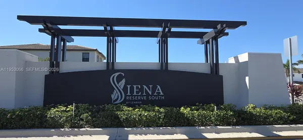 a view of front door and potted plants