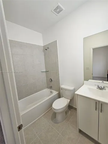 a bathroom with a sink a toilet and a bathtub