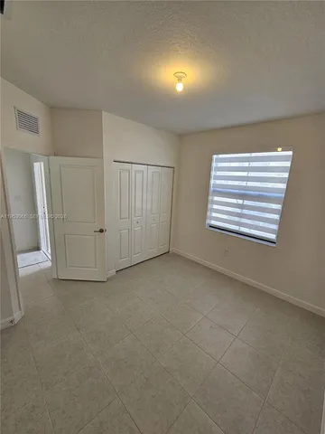 a view of empty room with windows