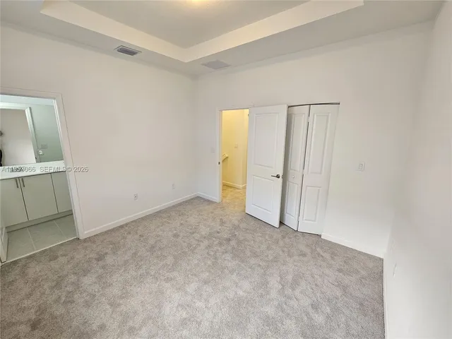 an empty room with closet area