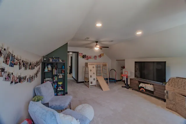 a spacious bedroom with a bed and a window