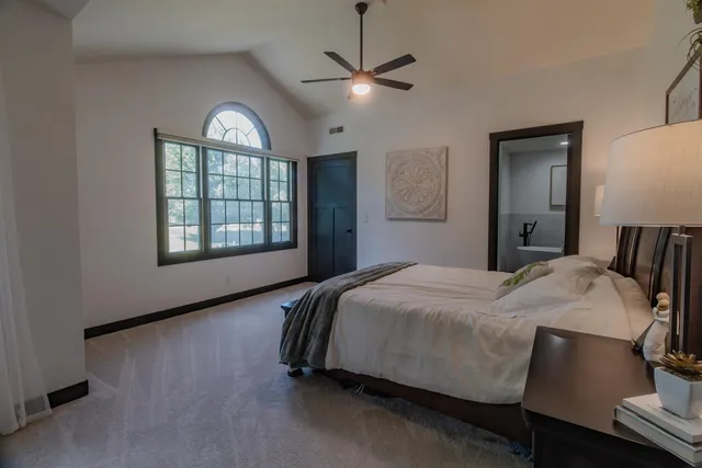 a bedroom with furniture and a baby crib