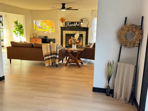 a living room with furniture and a large window