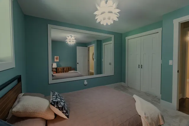 a spacious bathroom with a double vanity sink and mirror