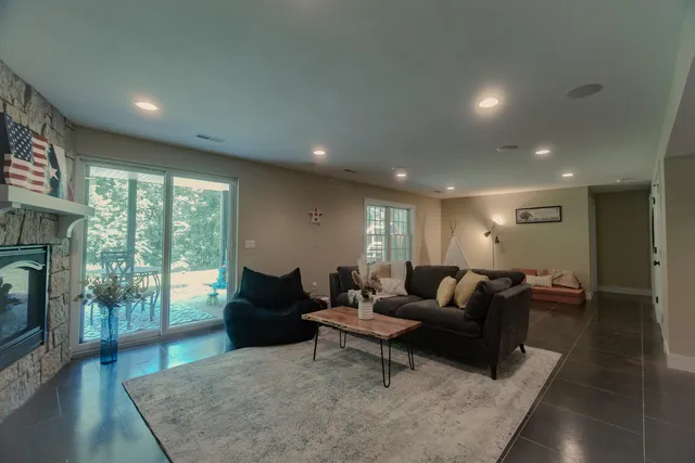 a living room with furniture and a potted plant