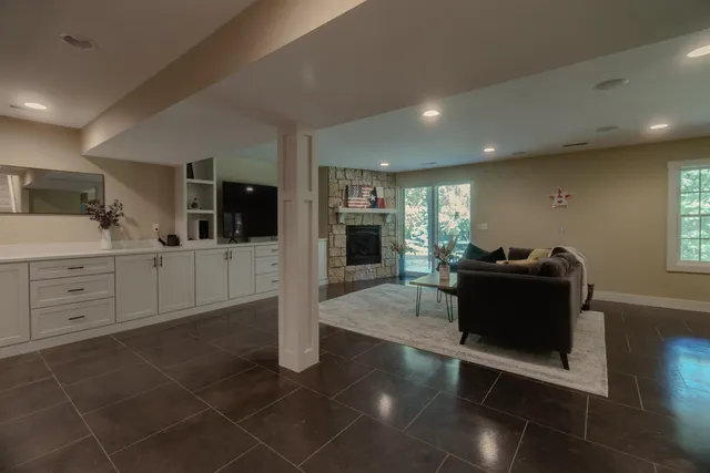 a living room with furniture and a large window