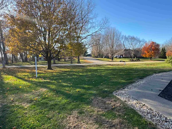 a kitchen with a refrigerator a sink and cabinets