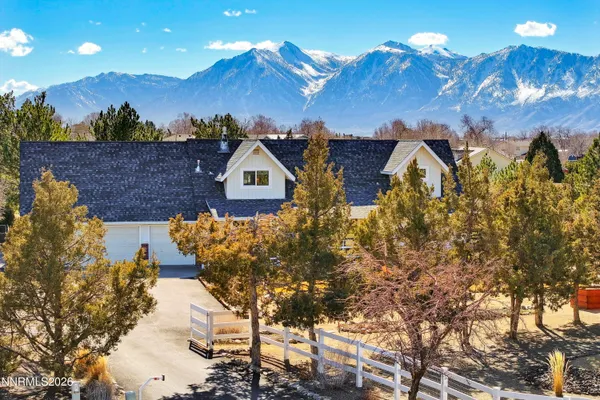 a view of a snow covered with snow in front of house