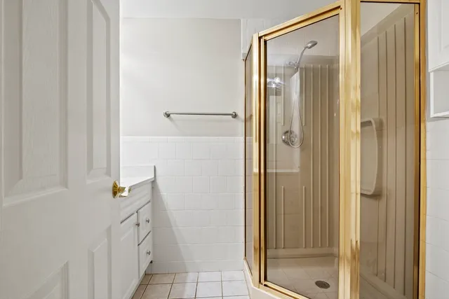 a bathroom with a shower and a sink