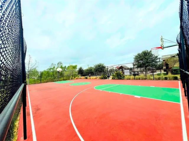 a view of a swimming pool with outdoor seating