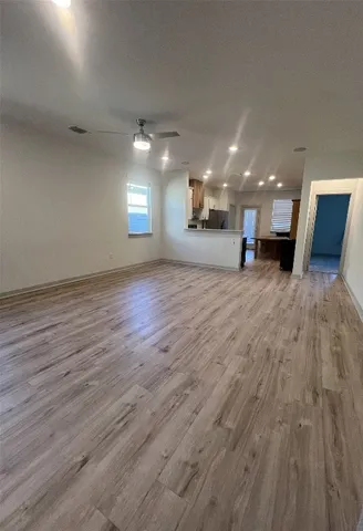 a view of a livingroom with wooden floor