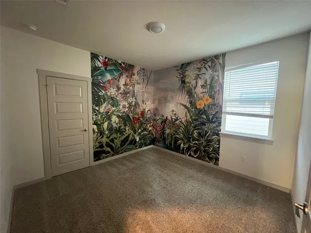 a view of an empty room and window