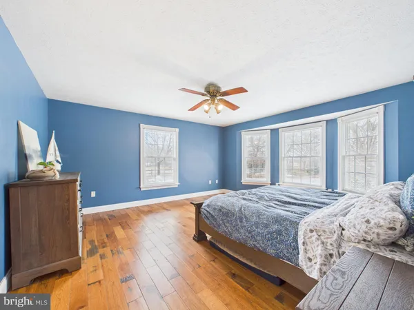 a spacious bathroom with a double vanity sink mirror and toilet