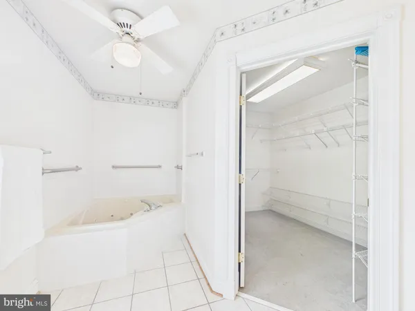 a room with a bed and a chandelier