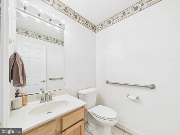 a bedroom with a bed rug and couch