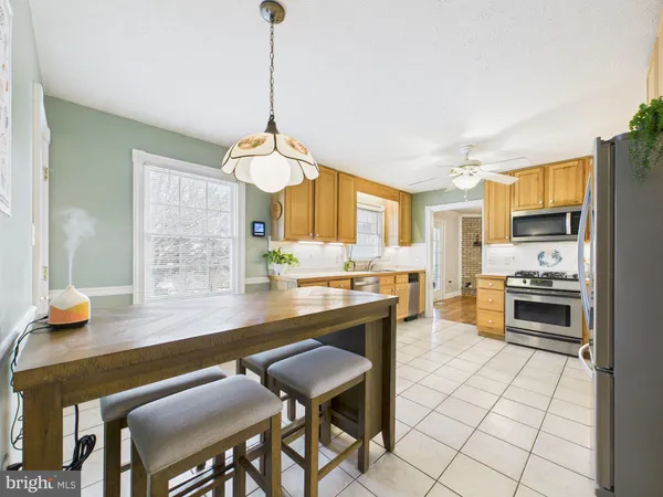 a kitchen with a sink cabinets and window