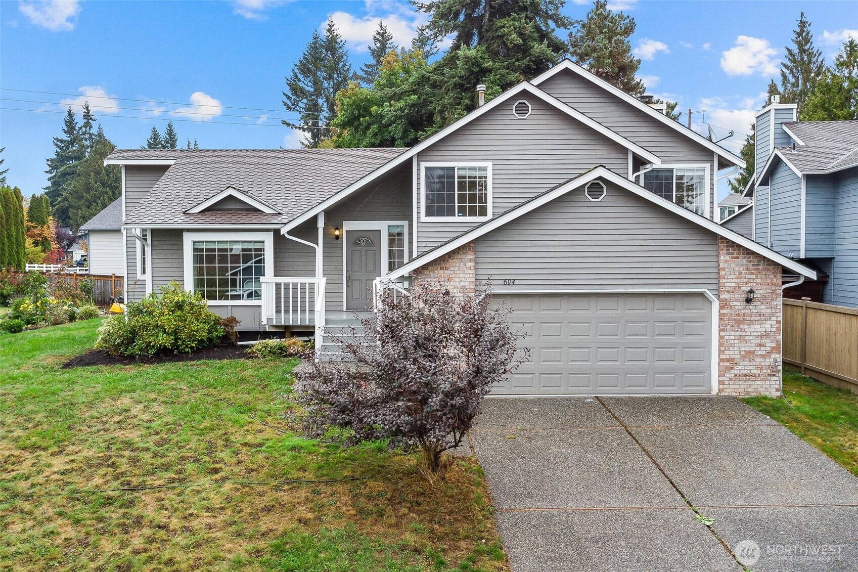 604 213th Street Southwest Bothell, WA 98021 - Photo 2 of 40 a view of a yard in front view of a house