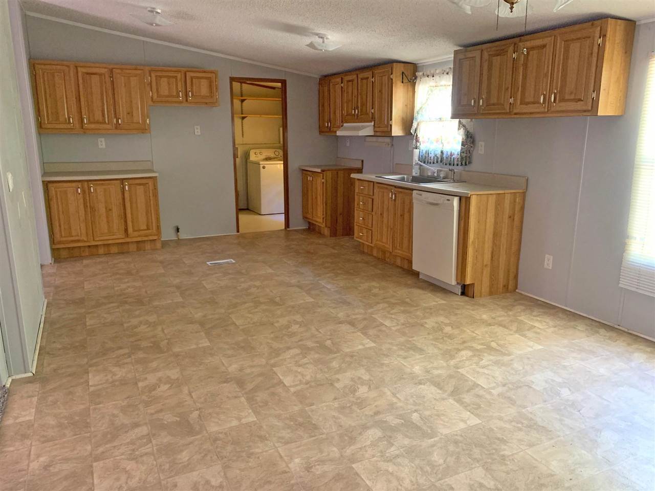 2176 Puron Road Adamsville, TN 38310 - Photo 2 of 24 a view of kitchen with window and cabinets
