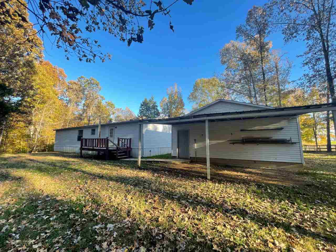 2176 Puron Road Adamsville, TN 38310 - Photo 23 of 24 a view of a house with a yard