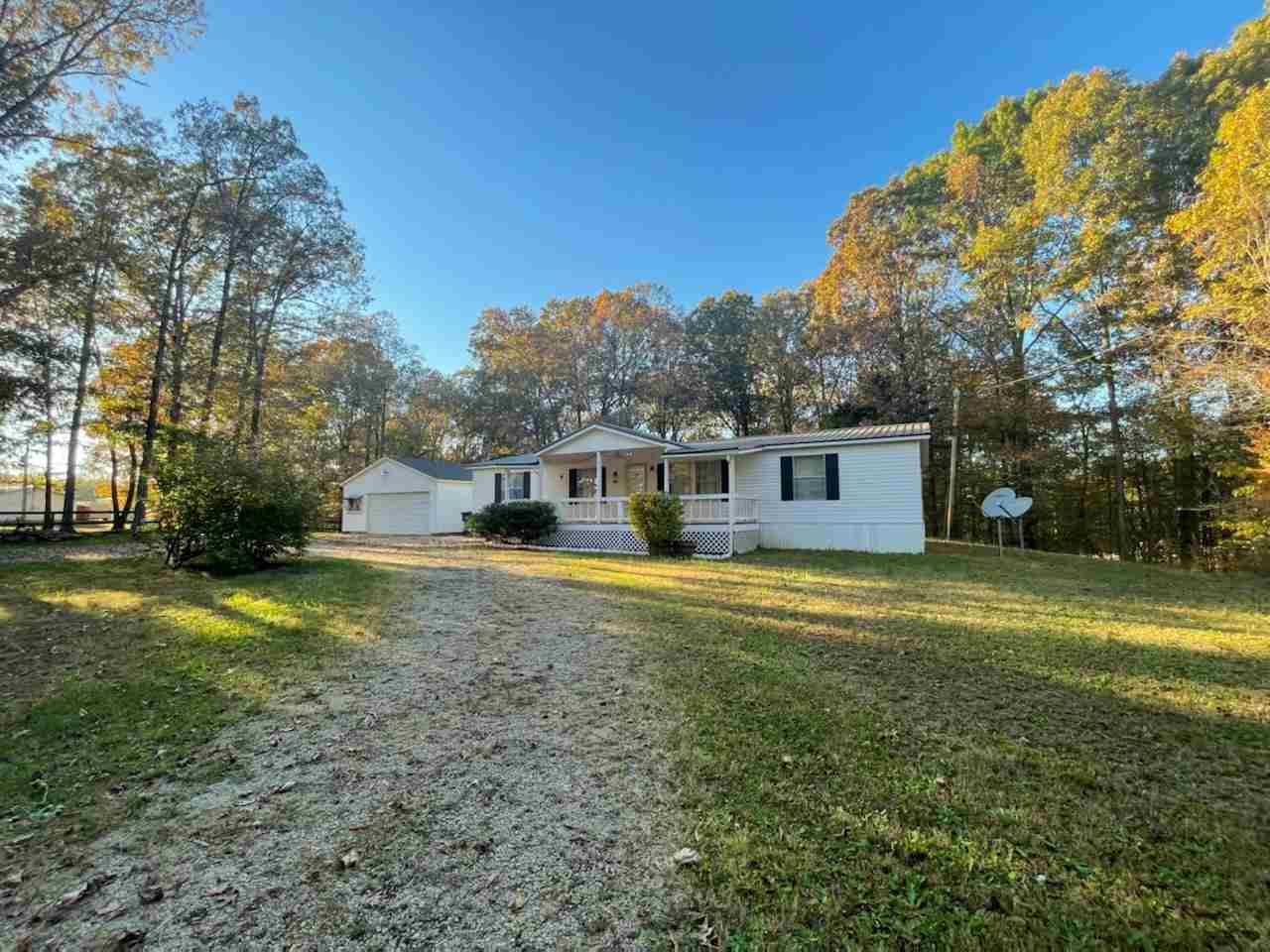 2176 Puron Road Adamsville, TN 38310 - Photo 24 of 24 a front view of a house with a garden
