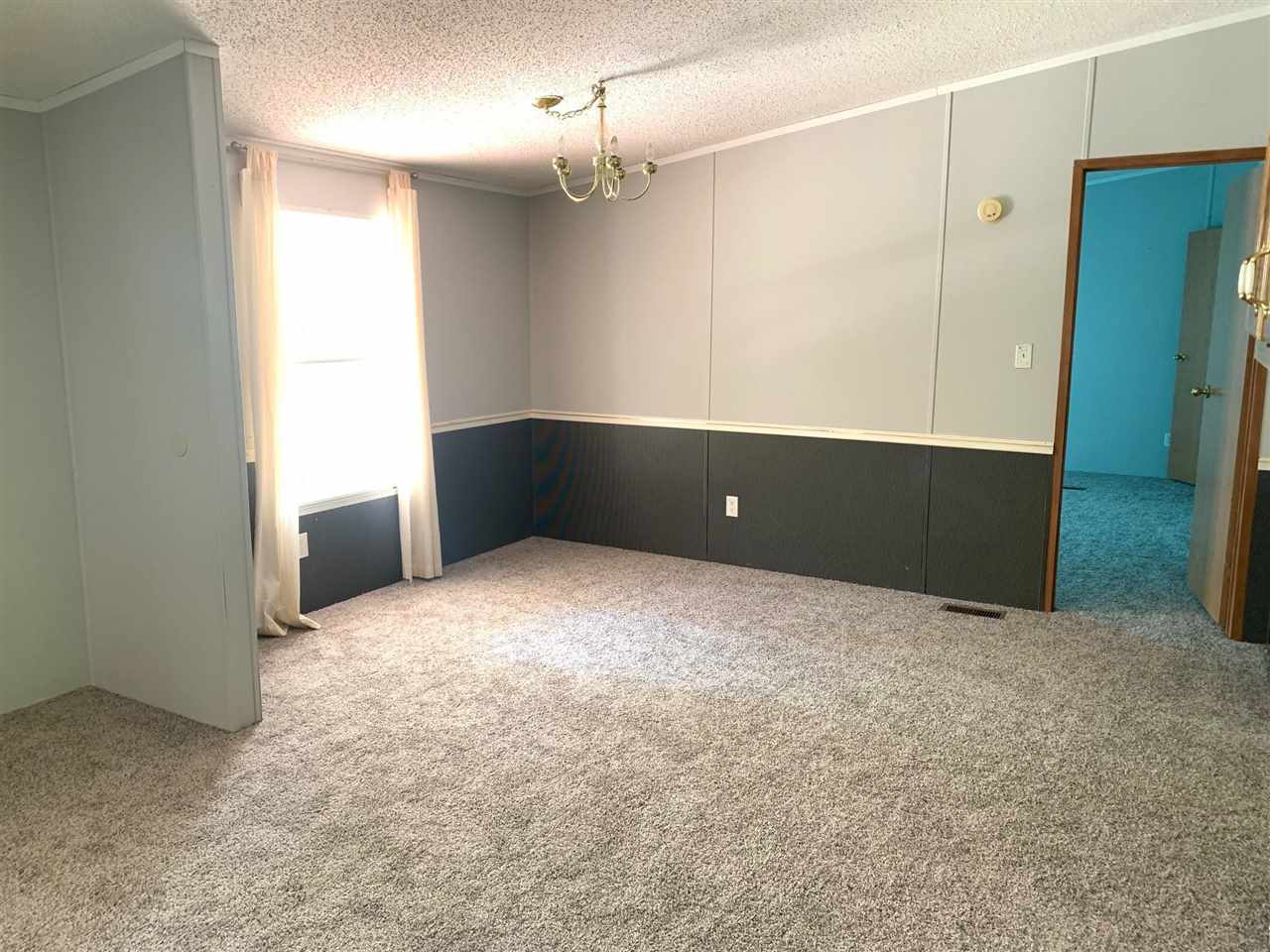 2176 Puron Road Adamsville, TN 38310 - Photo 5 of 24 a view of an empty room with a window