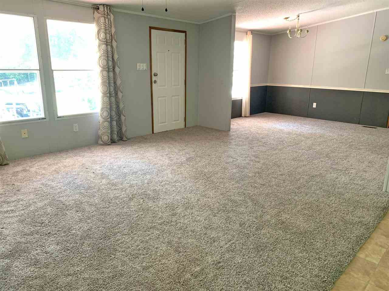 2176 Puron Road Adamsville, TN 38310 - Photo 6 of 24 a view of an empty room with a window