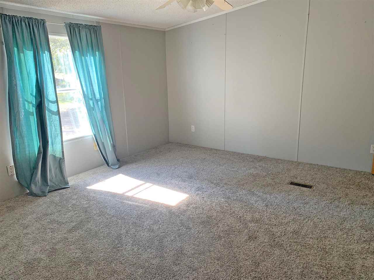 2176 Puron Road Adamsville, TN 38310 - Photo 7 of 24 an empty room with windows