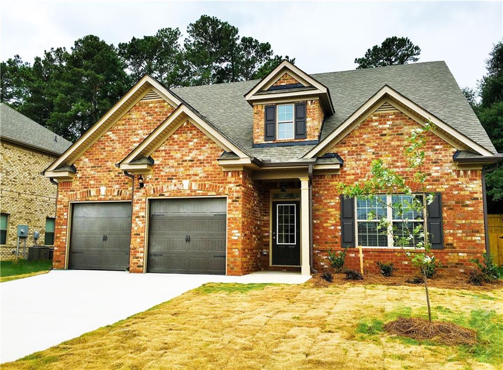 1128 Reddy Farm Lane Grayson, GA 30017 - Photo 1 of 1 Four sided brick home with private level yard.