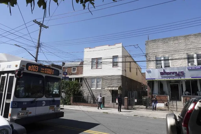 a view of a building with sitting area