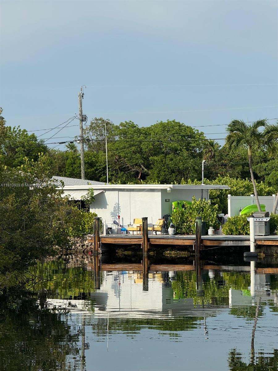 1301 Grouper Drive, Unit B Marathon, FL 33050 - Photo 15 of 39 a small swimming pool is sitting in the middle of a lake