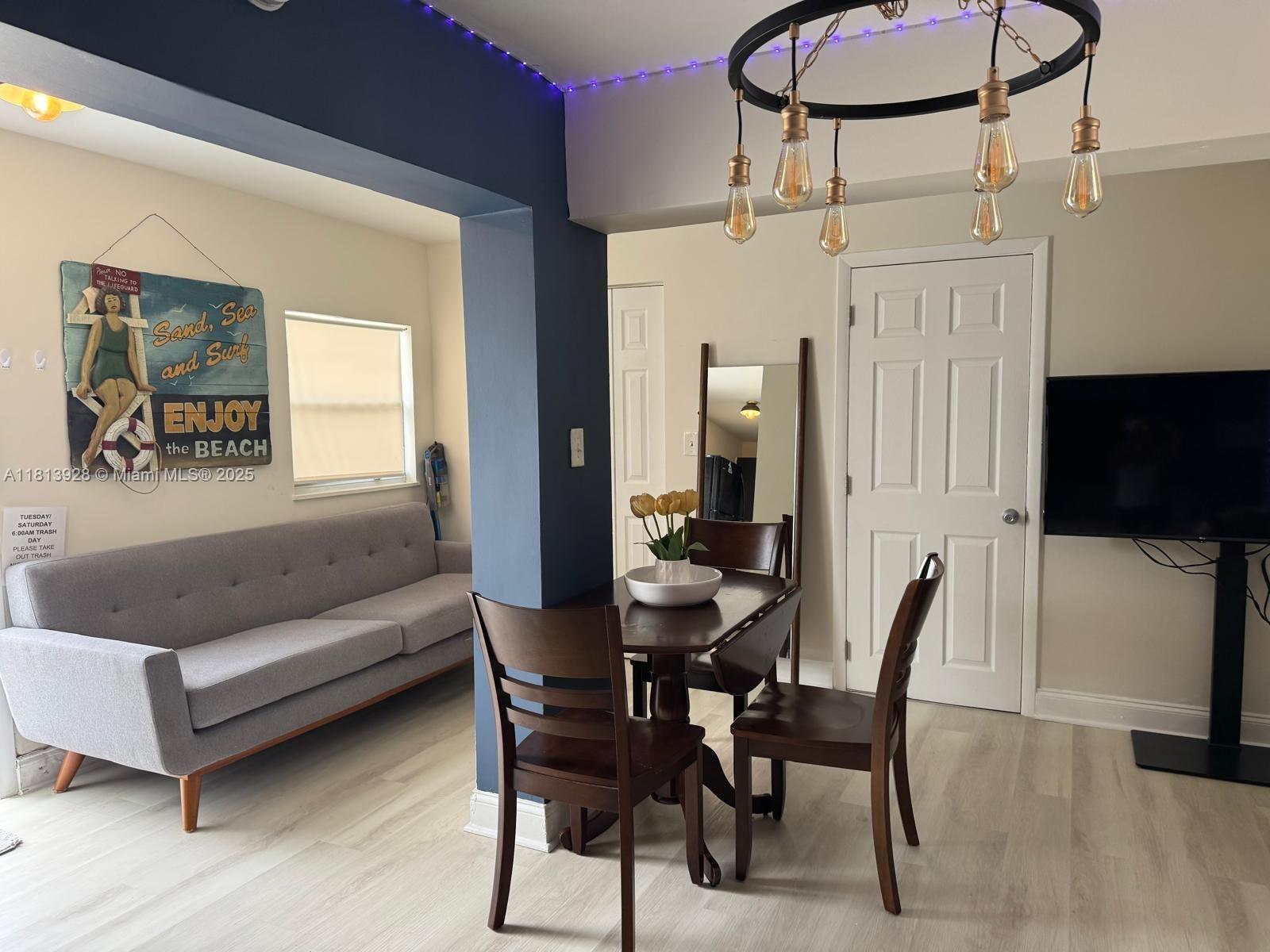 1301 Grouper Drive, Unit B Marathon, FL 33050 - Photo 2 of 39 a dining room with furniture and wooden floor