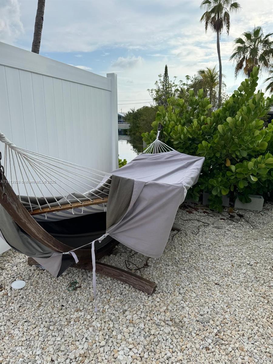 1301 Grouper Drive, Unit B Marathon, FL 33050 - Photo 25 of 39 a view of a backyard with lawn chairs