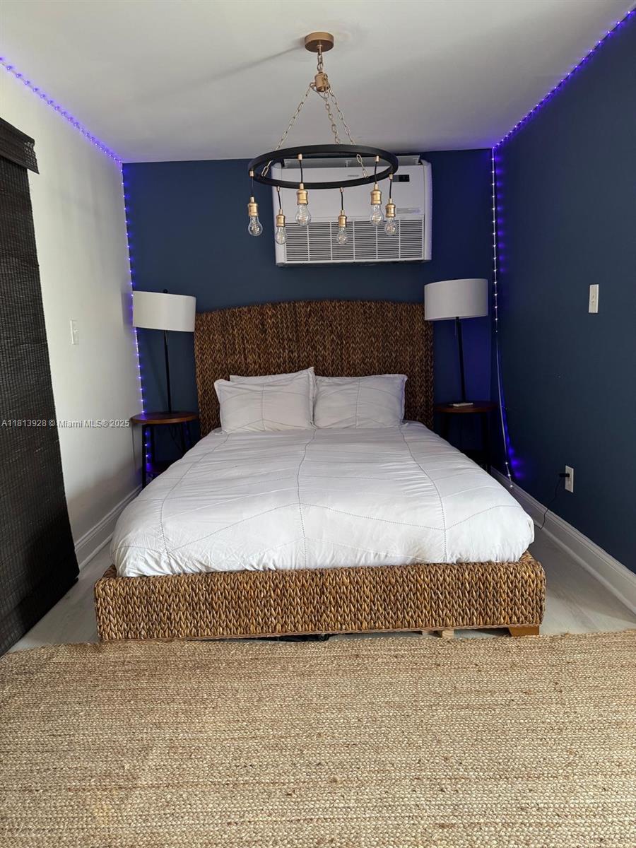 1301 Grouper Drive, Unit B Marathon, FL 33050 - Photo 27 of 39 a bedroom with a bed dresser and a window