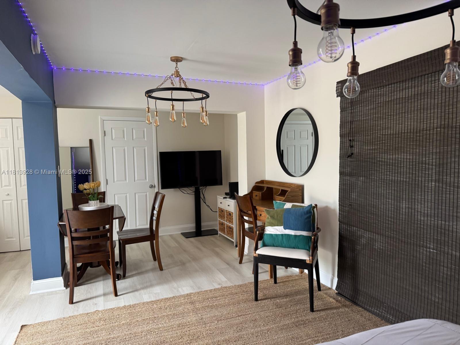 1301 Grouper Drive, Unit B Marathon, FL 33050 - Photo 32 of 39 a living room with furniture a rug and a flat screen tv