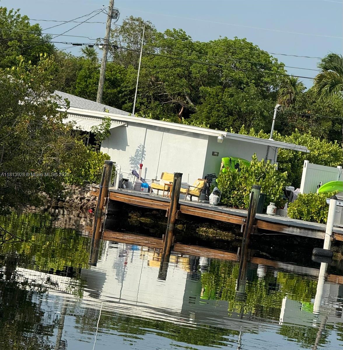 1301 Grouper Drive, Unit B Marathon, FL 33050 - Photo 5 of 39 a view of a chairs and table in the patio
