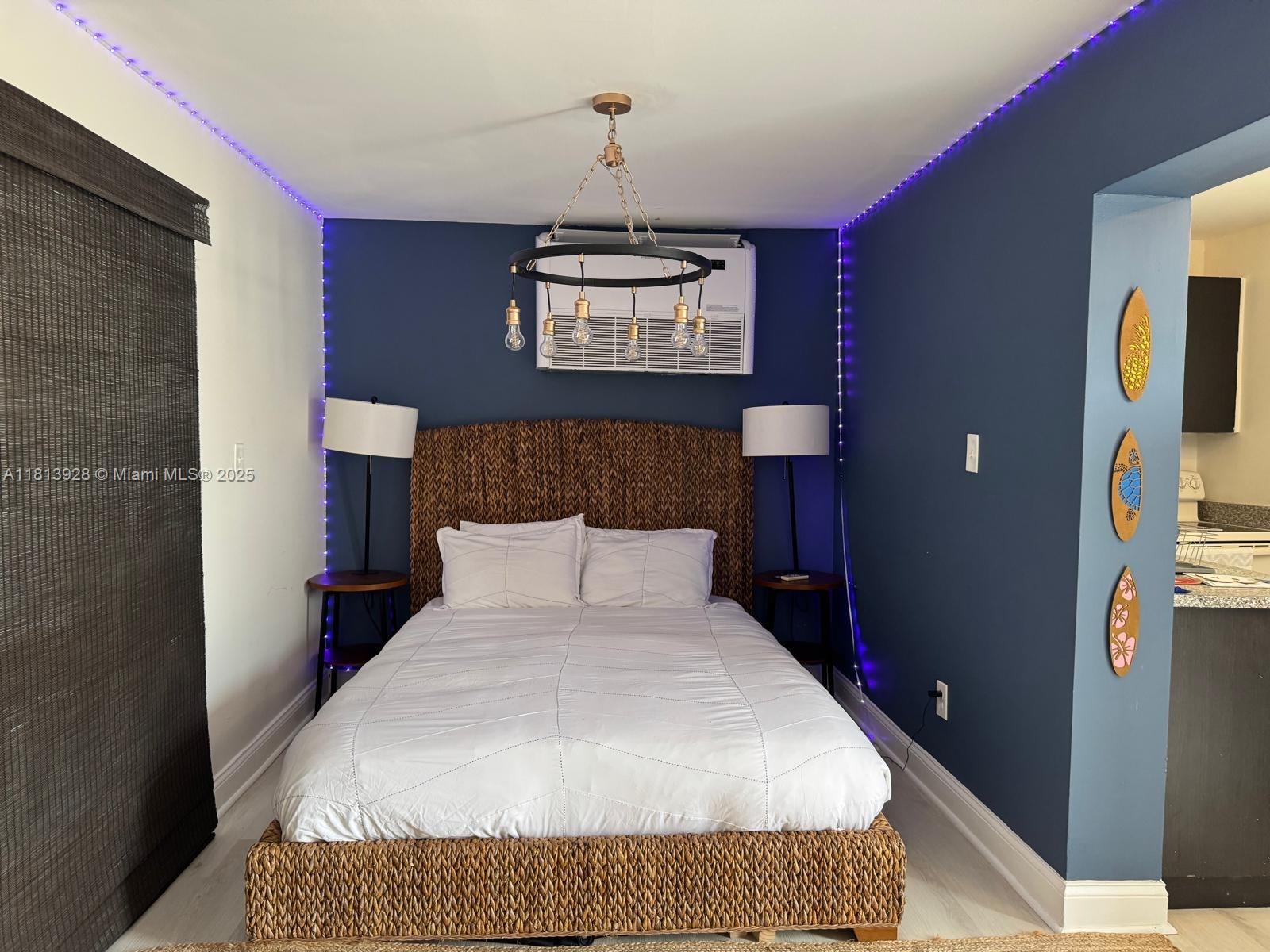 1301 Grouper Drive, Unit B Marathon, FL 33050 - Photo 6 of 39 a bedroom with a bed and a flat screen tv