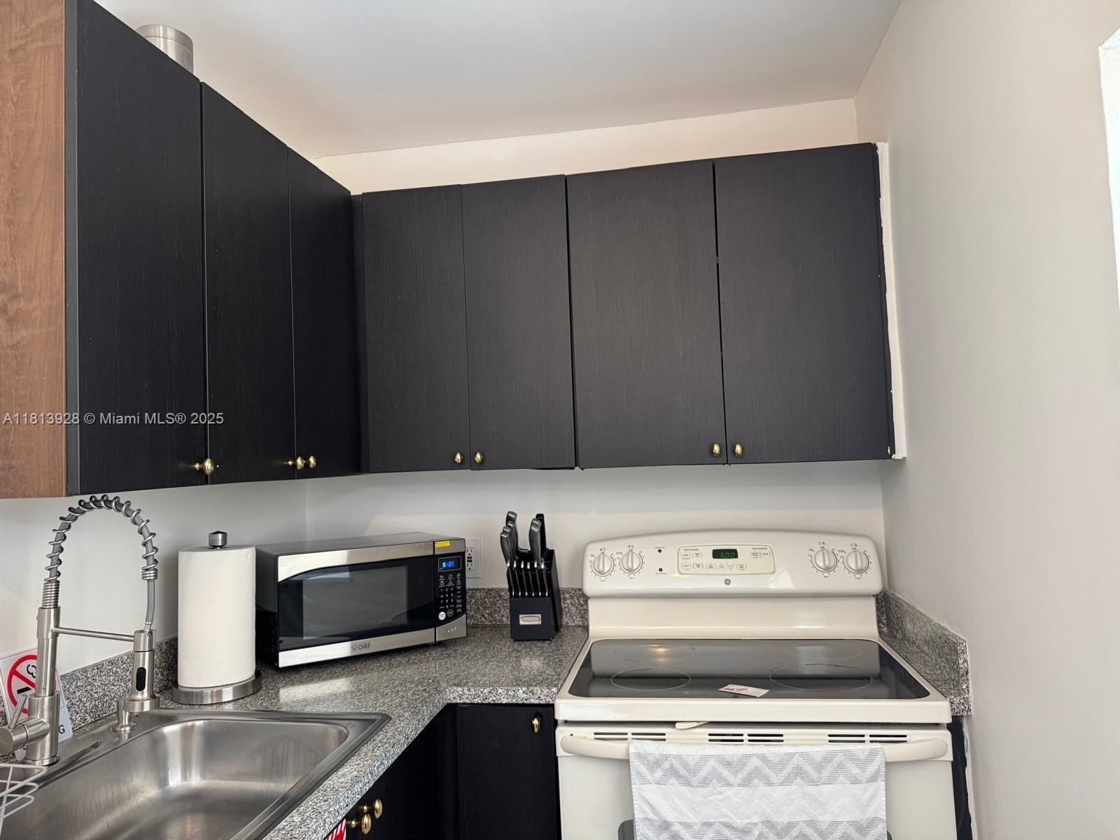 1301 Grouper Drive, Unit B Marathon, FL 33050 - Photo 7 of 39 a stove top oven sitting inside of a kitchen