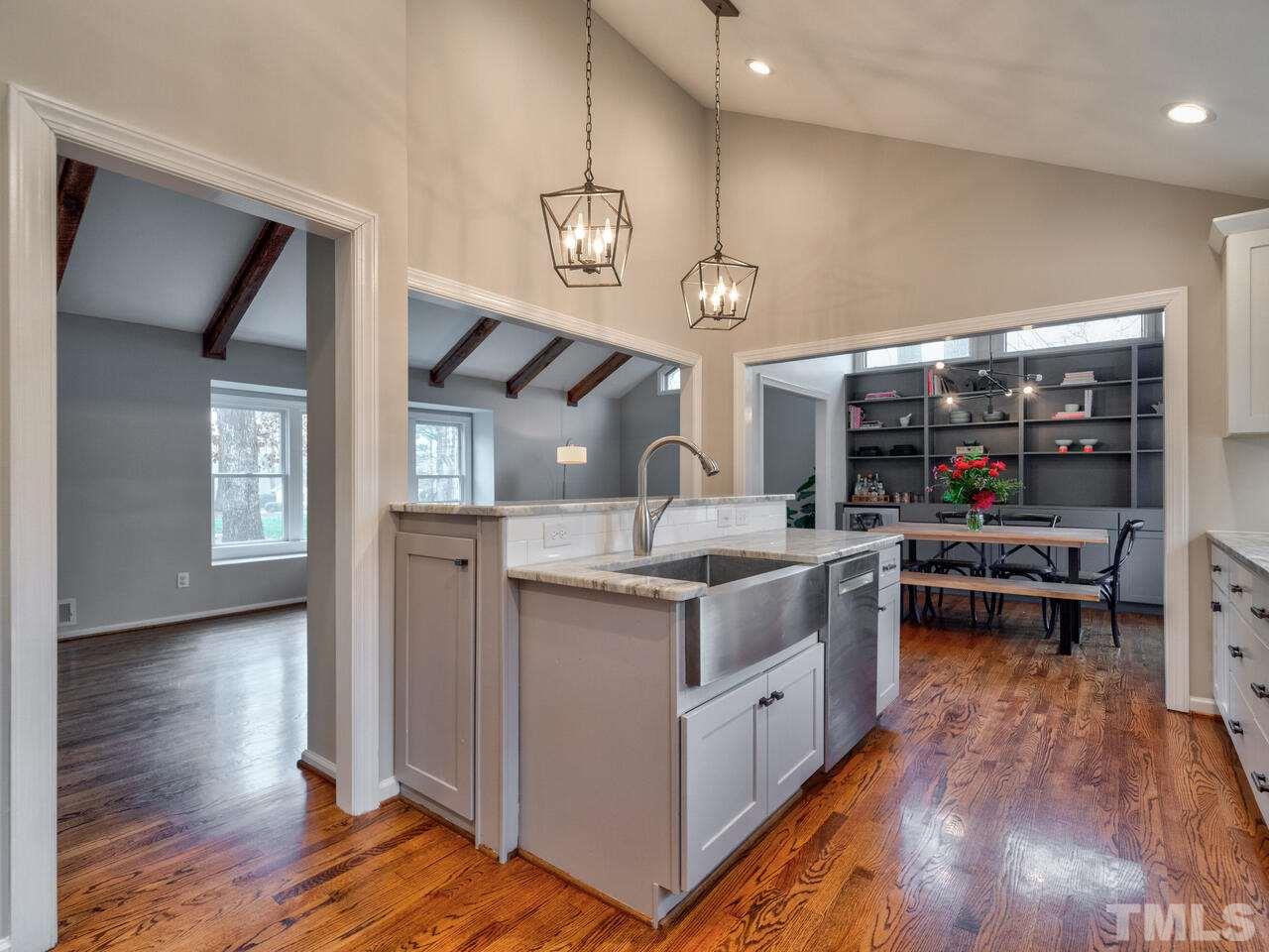 1201 Chardon Court Raleigh, NC 27609 - Photo 12 of 30 a kitchen with a stove and a wooden floor
