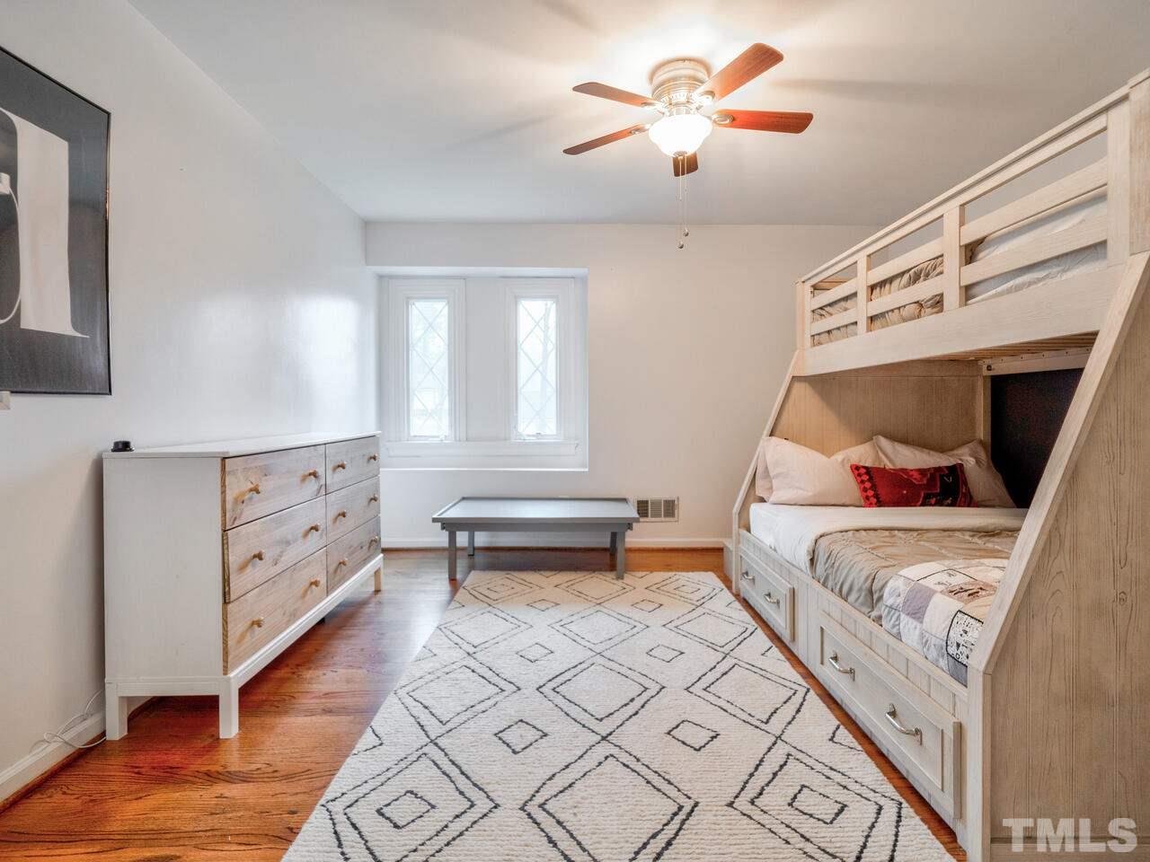 1201 Chardon Court Raleigh, NC 27609 - Photo 21 of 30 a bedroom with furniture and a baby crib