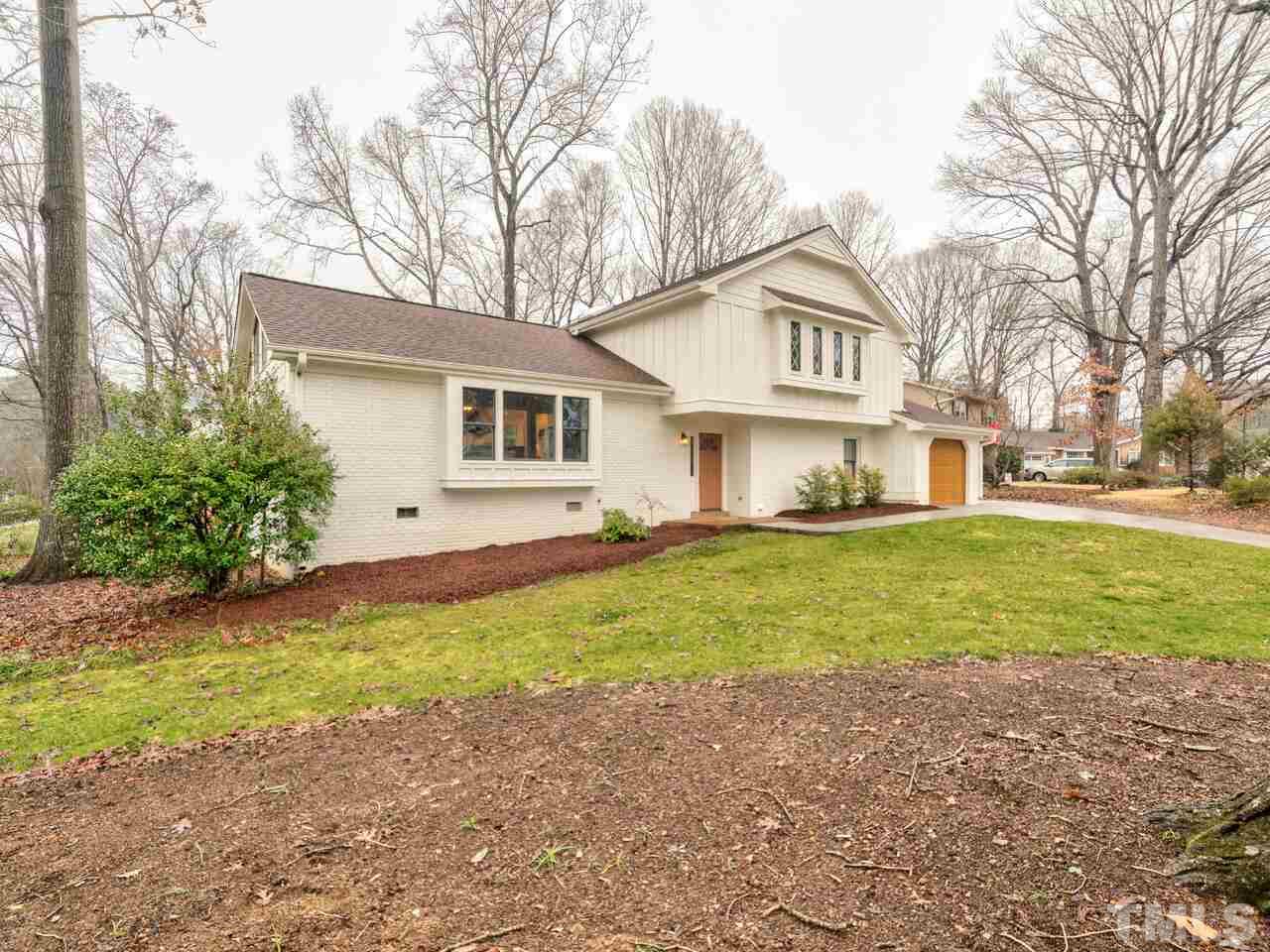 1201 Chardon Court Raleigh, NC 27609 - Photo 26 of 30 a view of a house with a yard and large trees