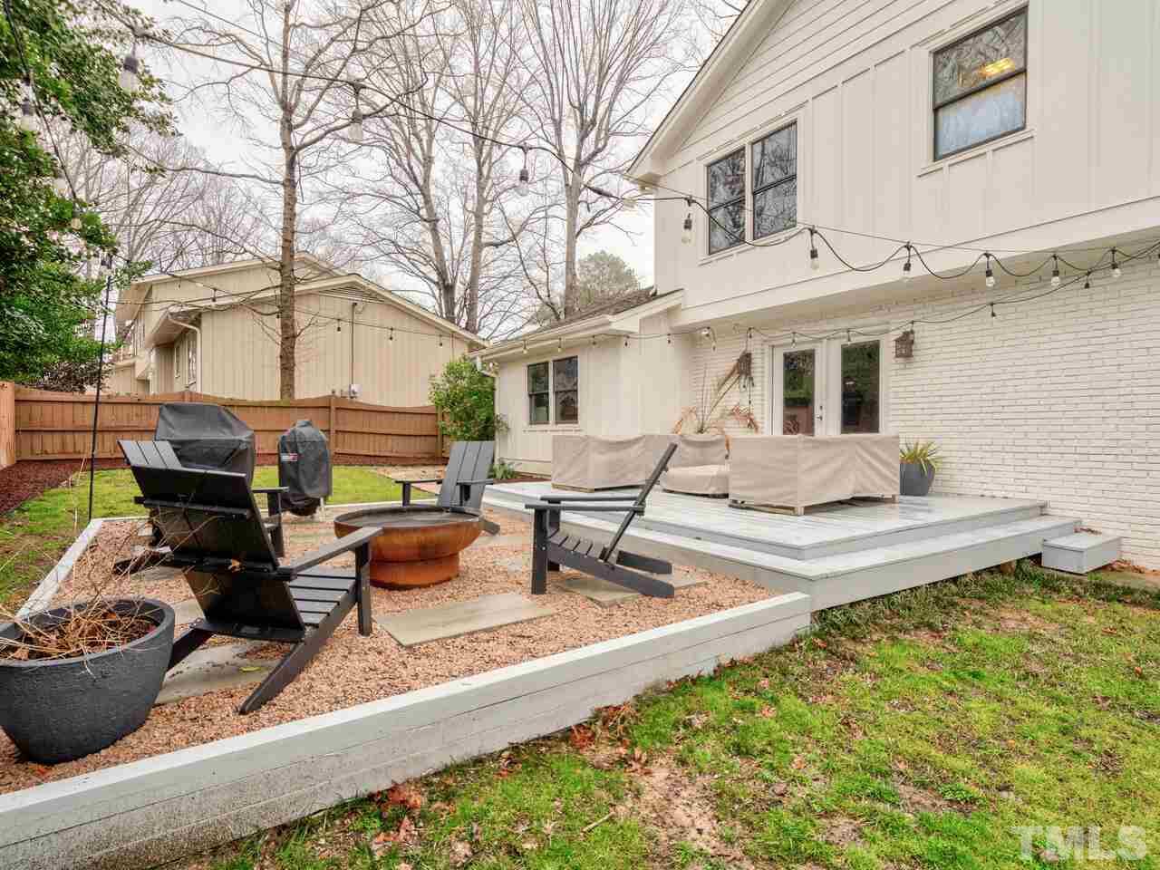 1201 Chardon Court Raleigh, NC 27609 - Photo 28 of 30 a view of a house with backyard and sitting area