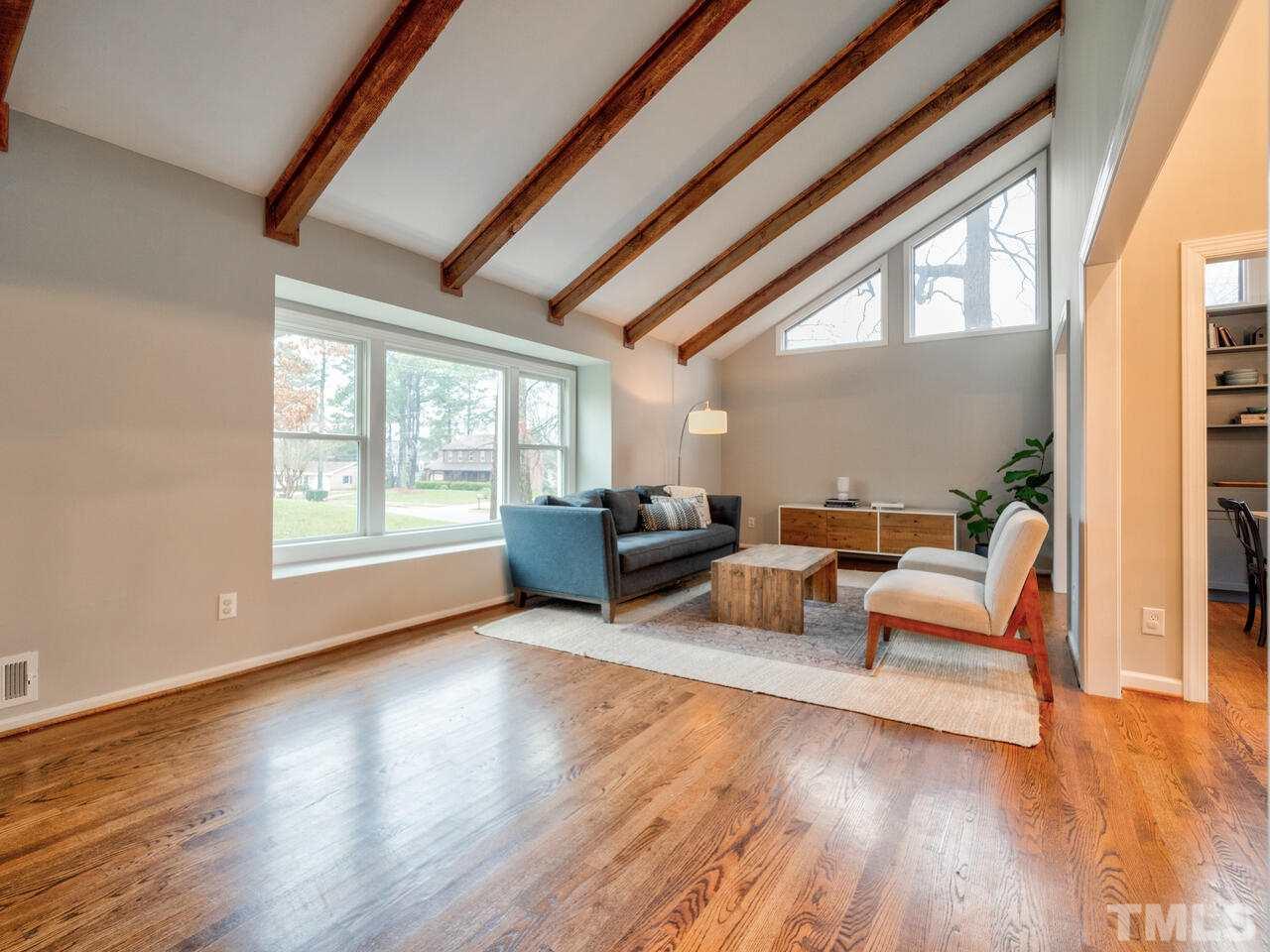 1201 Chardon Court Raleigh, NC 27609 - Photo 6 of 30 a living room with furniture and a large window
