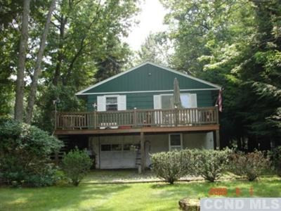1080 Lakeview Road Copake, NY 12516 - Photo 1 of 1 a house with river in front of it